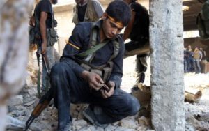 A rebel fighter during clashes with government forces in Ramussa, southwest Aleppo Credit: AFP 