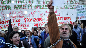 Greek demonstrators protest against government austerity measures outside the Greek Parliament in Athens (CNN, 2010)