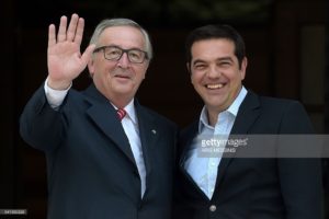 Greek Prime Minister Alexis Tsipras (R) welcomes the President of the European Commission Jean-Claude Juncker before their meeting in Athens on June 21, 2016. ( AFP ARIS)