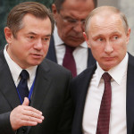 MINSK, BELARUS. OCTOBER 10, 2014. Russian president Vladimir Putin, presidential aide Sergei Glazyev (R-L front) and foreign minister Sergei Lavrov (background) at a session of the Supreme Eurasian Economic Council at the level of heads of states at Minsk's Palace of Independence. Mikhail Metzel /TASS Белоруссия. Минск. 10 октября. Советник президента РФ Сергей Глазьев, президент России Владимир Путин (слева направо на первом плане) и министр иностранных дел РФ Сергей Лавров (на втором плане) в перерыве заседания Высшего Евразийского экономического совета на уровне глав государств во Дворце Независимости. Михаил Метцель/ТАСС